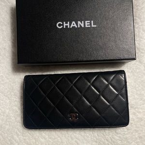 Authenticated Chanel lambskin black wallet with box and COA